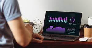 Data Analysis on Computer Screen at Desk